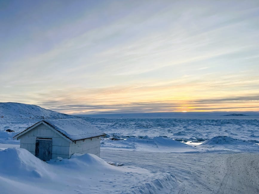 Snowy Arctic landscape with a house and frozen ocean in Apex, Nunavut, Canada - personal loan Nunavut