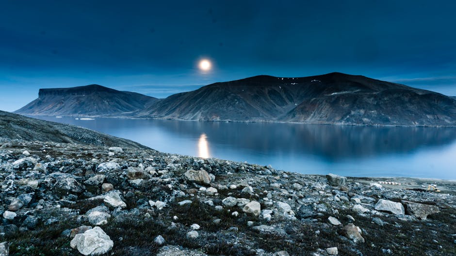 Moonlit rugged landscape and waters of Baffin Island, Nunavut - online personal loan Baffin Island
