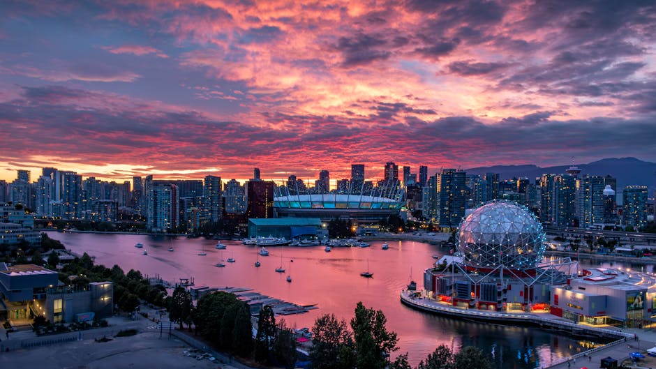 Vancouver cityscape at sunset reflecting on harbour - personal loans British Columbia
