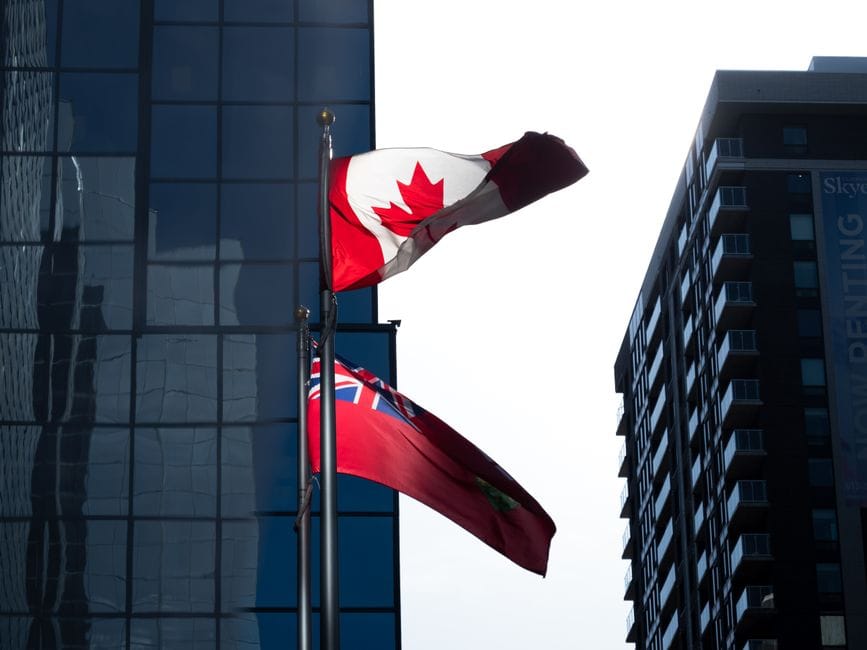 Canadian flags waving in downtown Ottawa — personal loans available by province across Canada