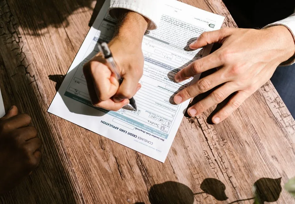 Canadian applicant completing a fair credit personal loan application form