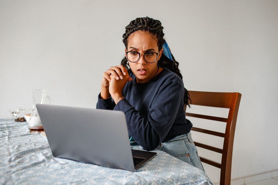 Researching loan options on a laptop - online loan matching Canada