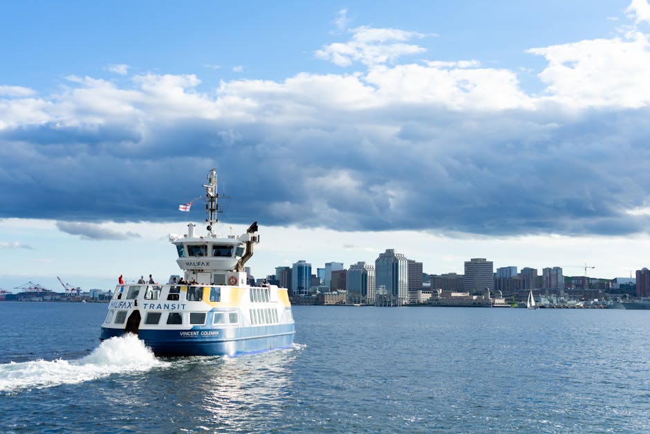 Halifax Transit ferry crossing the harbour with the downtown skyline in the background on a clear day. - personal loan Canada