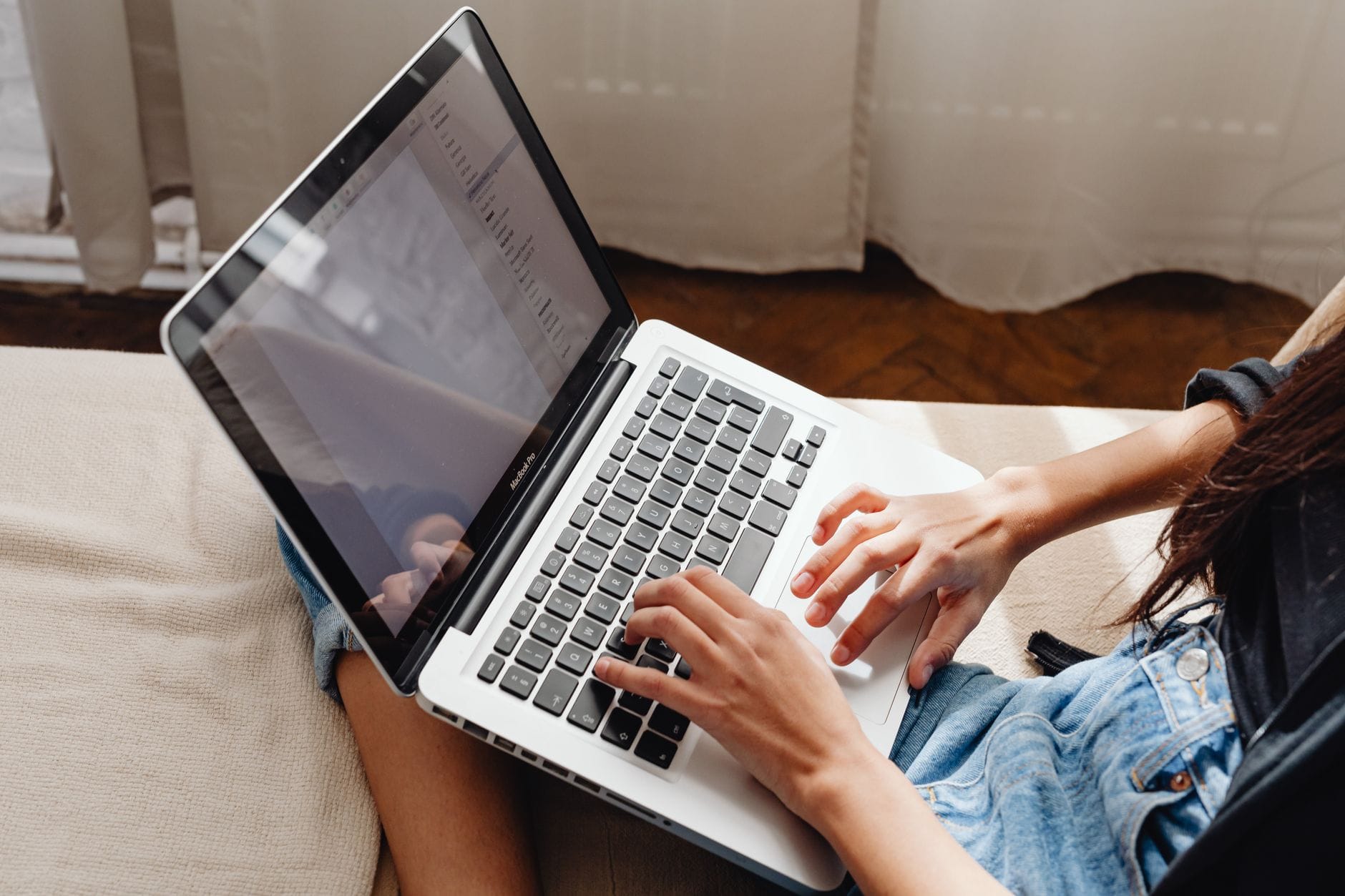 Person researching loans on a laptop - online loans not direct lenders in Canada