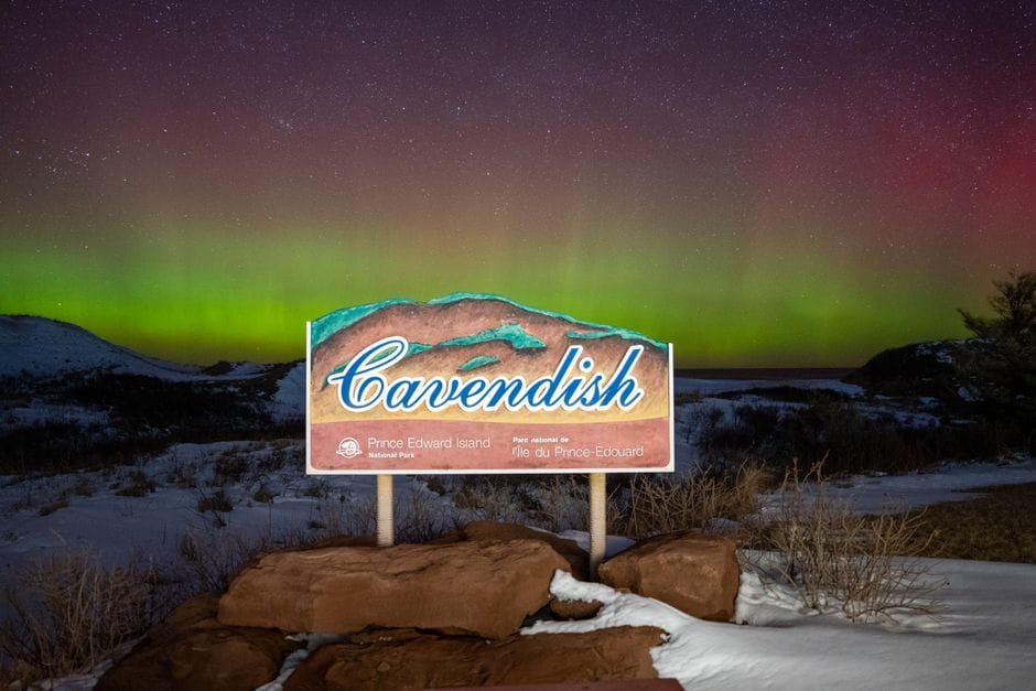 Cavendish sign in PEI National Park under the northern lights - personal loans PEI