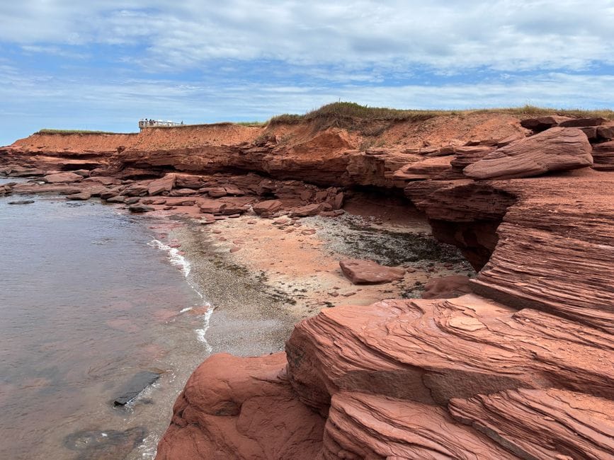Red sandstone cliffs and beach, Prince Edward Island - personal loans PEI