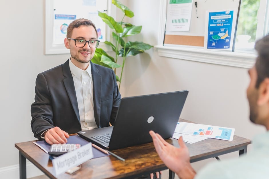 Mortgage broker discussing loan options with a client - second chance loans Canada