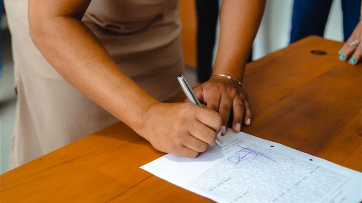 Borrower signing a personal loan agreement in Canada that is not taxable income