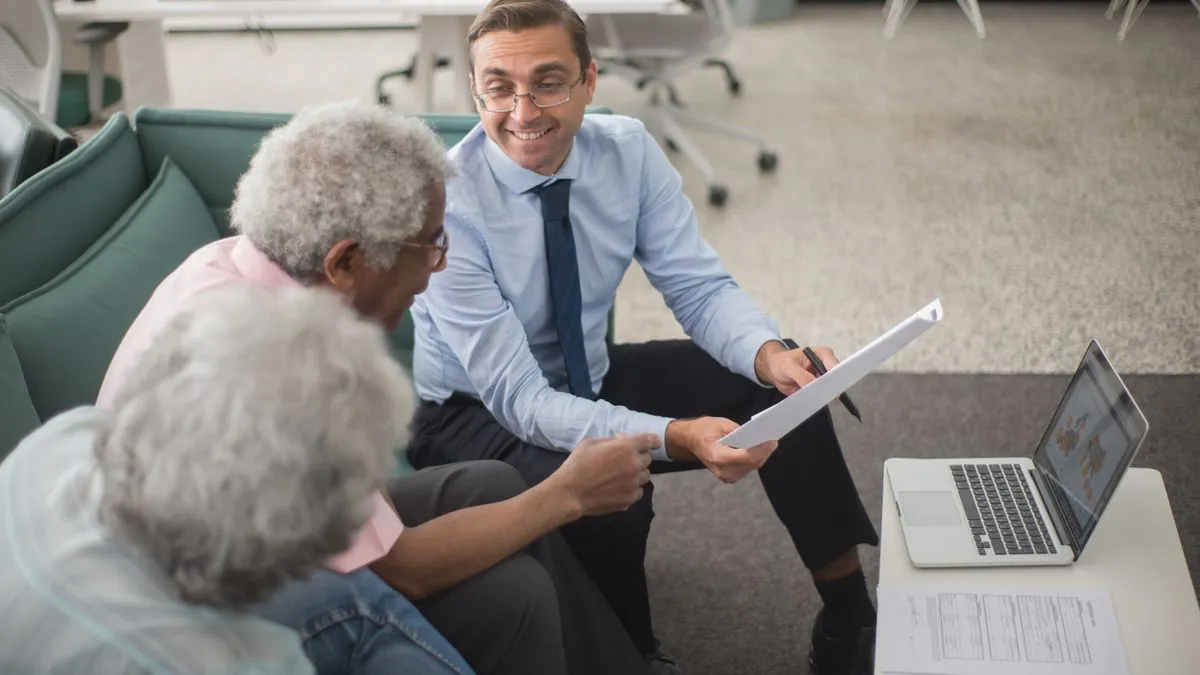 Advisor explaining where to get a personal loan in Canada to a couple