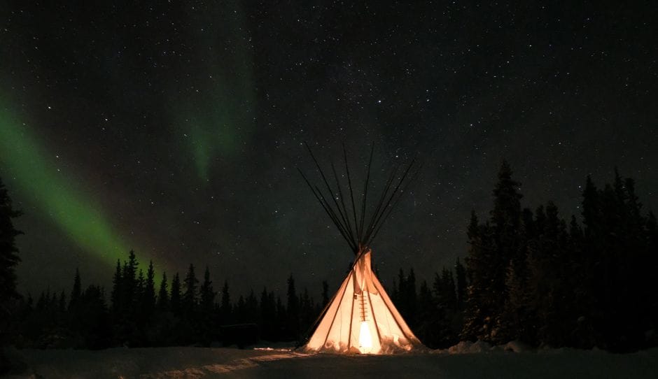 Aurora borealis over a teepee in Yellowknife, Northwest Territories - personal loans NWT