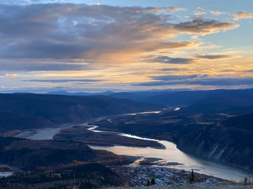 Yukon River winding through mountains at sunset - personal loan Yukon