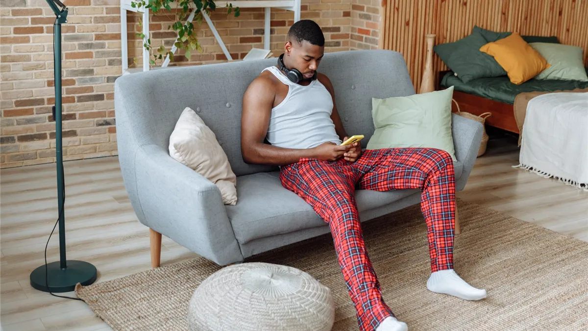 Ontario borrower applying for an installment loan from his phone at home