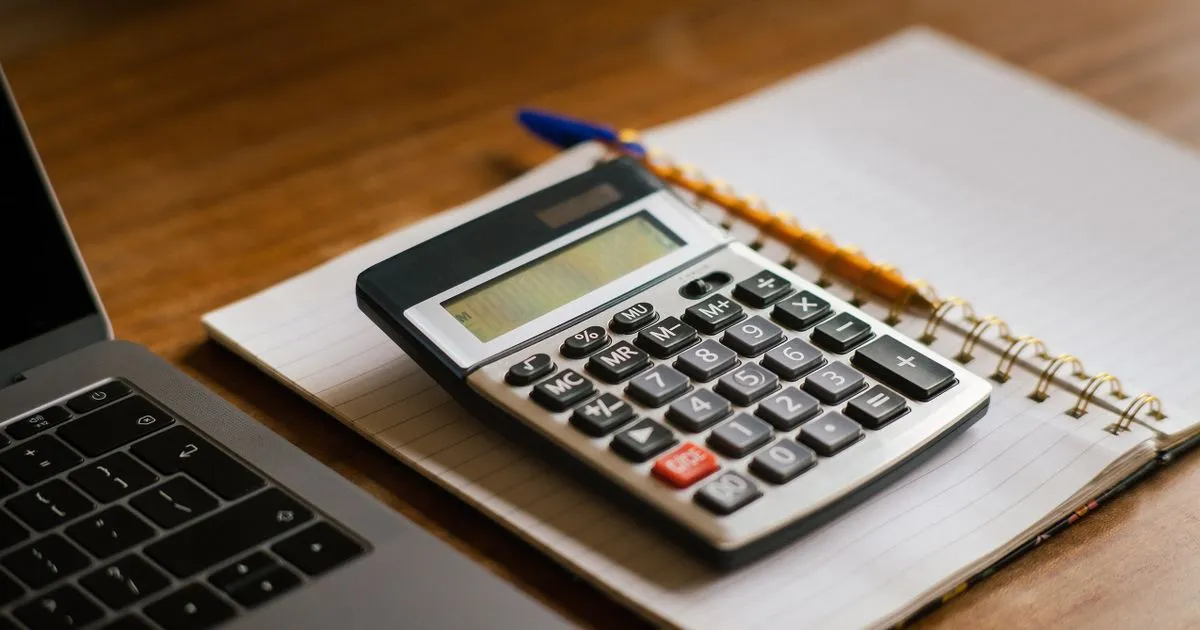 Planning installment loans BC payments with a calculator and notebook