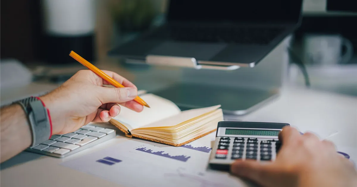 Planning installment loans Nova Scotia payments with a calculator and notebook