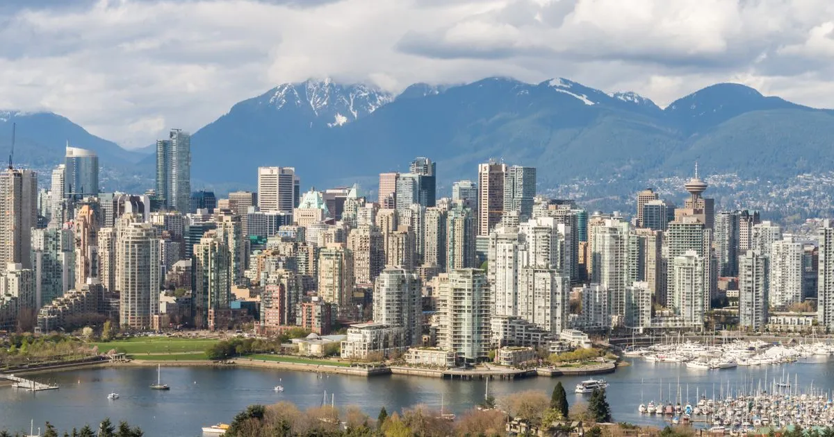 Vancouver skyline with the North Shore mountains - installment loans BC borrowers compare across the province