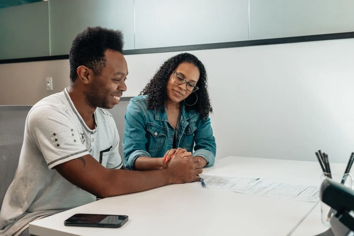 Couple reviewing a 1000 loan offer together at a table